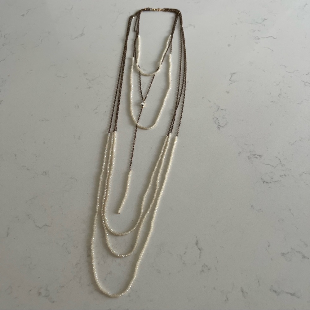Cream crystal bead and copper multi-length layered necklace with drop lariat